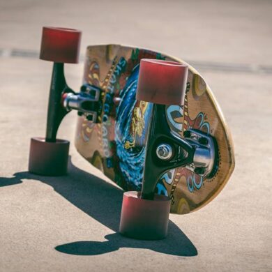 Shallow Focus Photography of Brown and Blue Skateboard